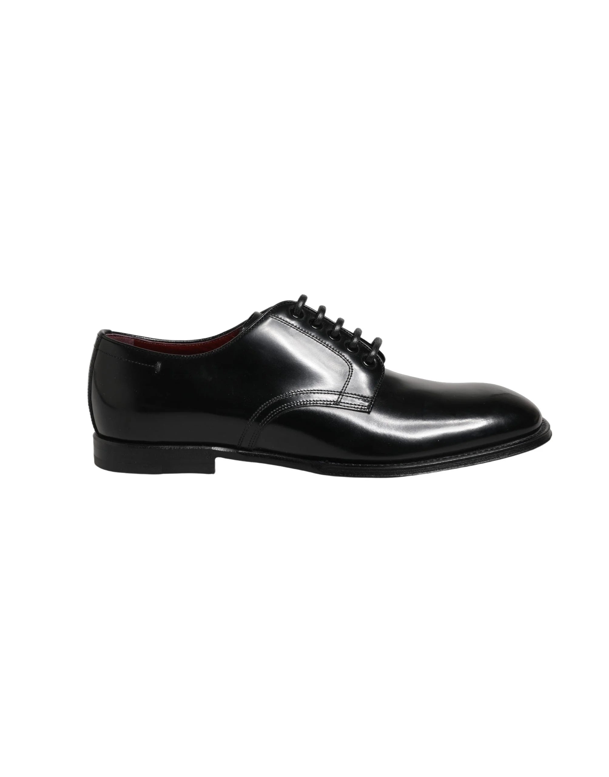 Pair of Dolce & Gabbana black calfskin Derbies presented at an angle to show the lustrous finish and refined shape.