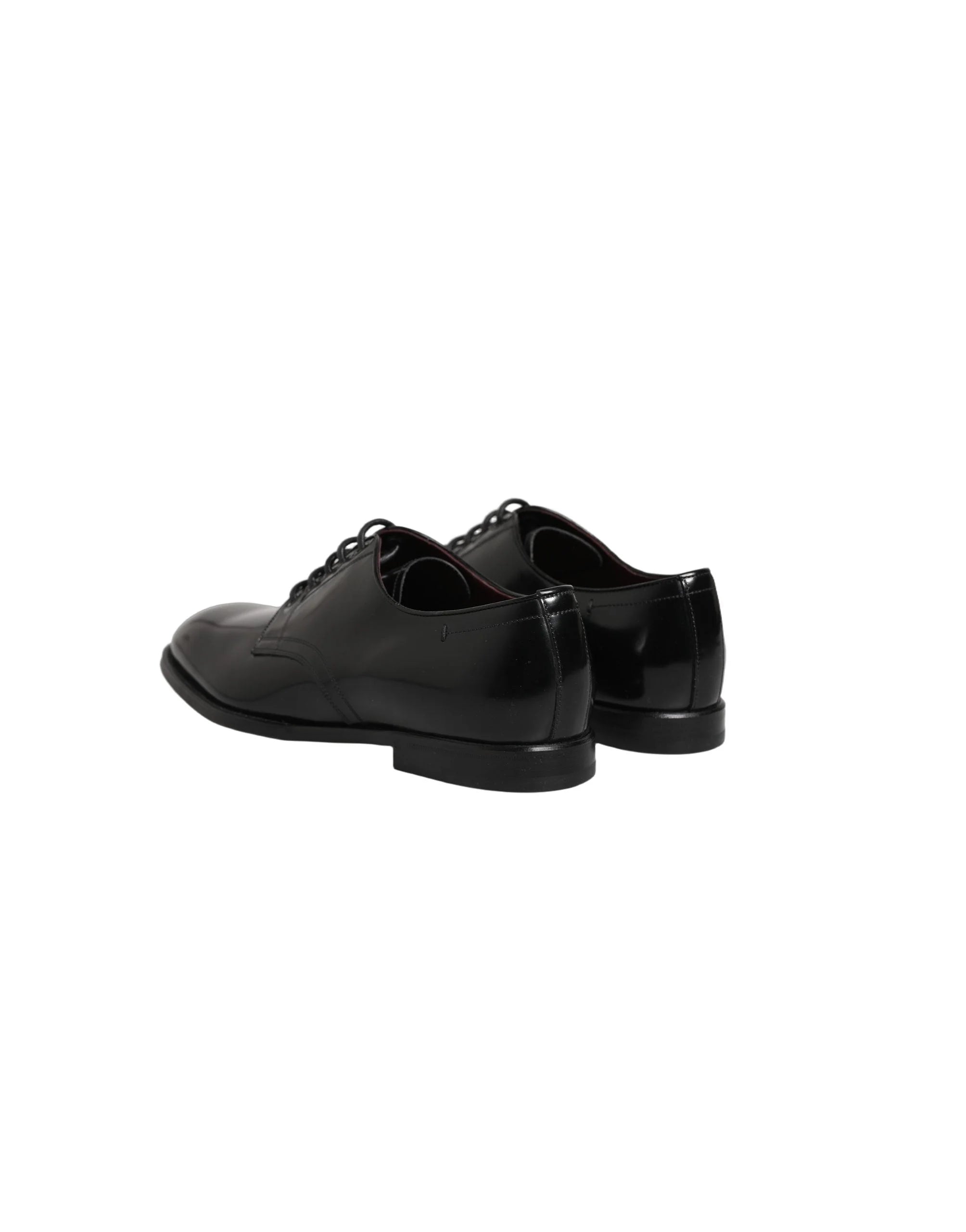 Close-up of the premium calfskin leather texture and waxed cotton laces on a Dolce & Gabbana men's formal shoe.
