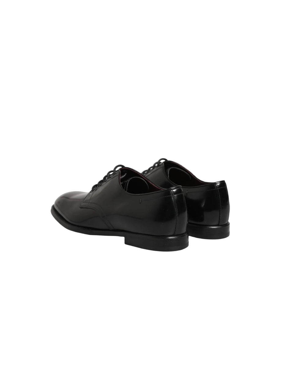 Close-up of the premium calfskin leather texture and waxed cotton laces on a Dolce & Gabbana men's formal shoe.