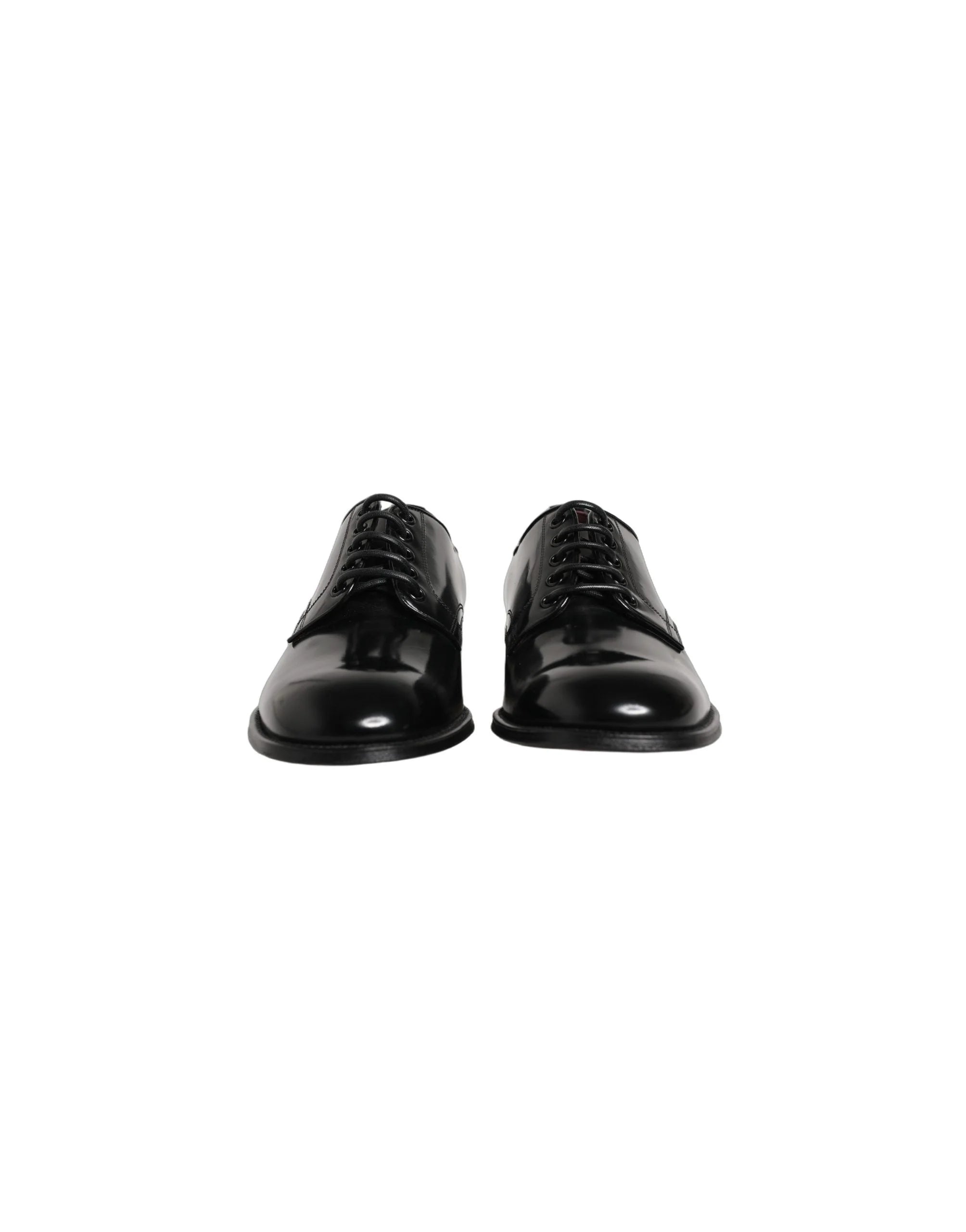 Side profile of Dolce & Gabbana men's black leather Derbies showing the elegant curve and stacked heel construction.