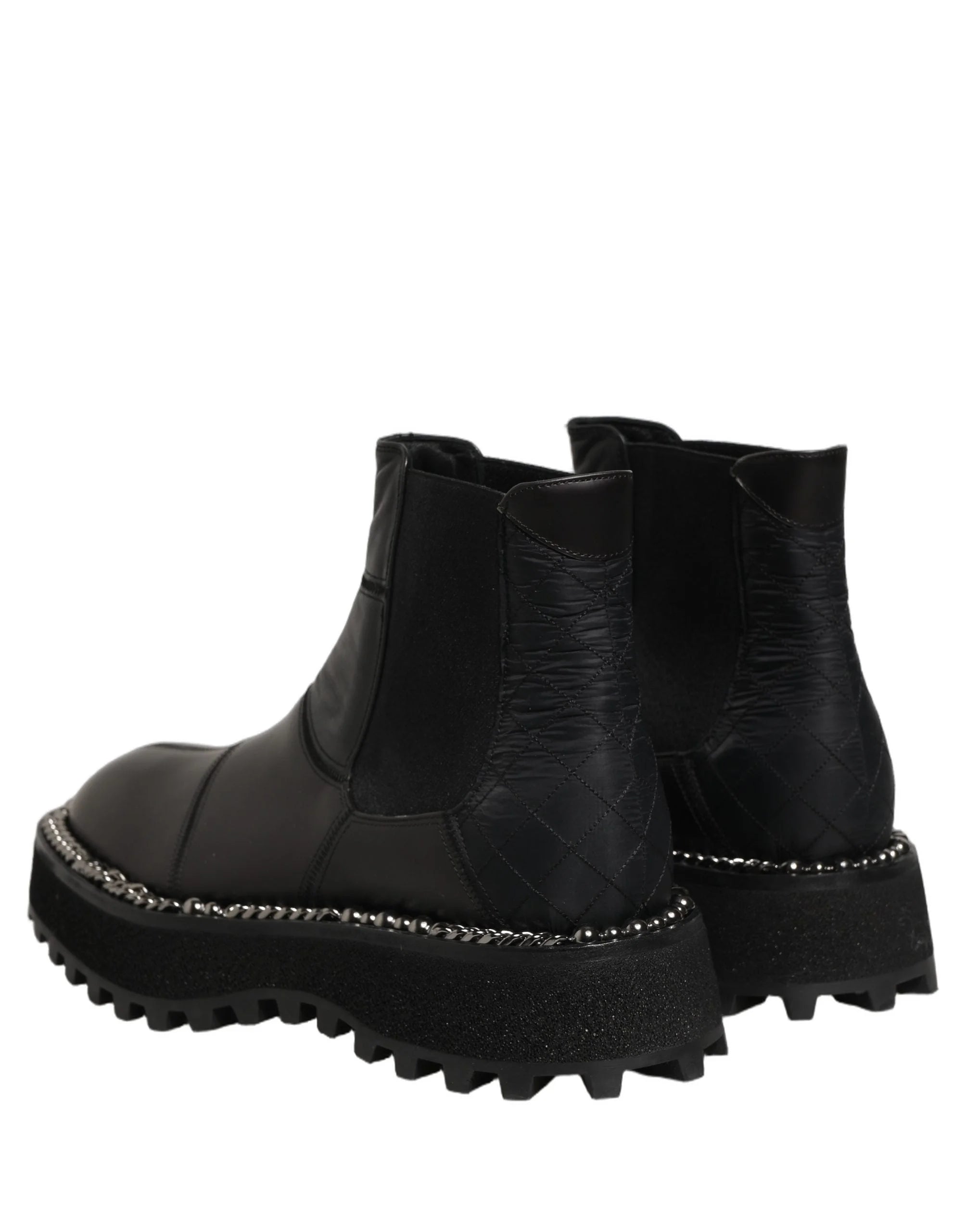 Dolce & Gabbana men's black leather Chelsea boots featuring a sleek almond toe and elasticated side panels.