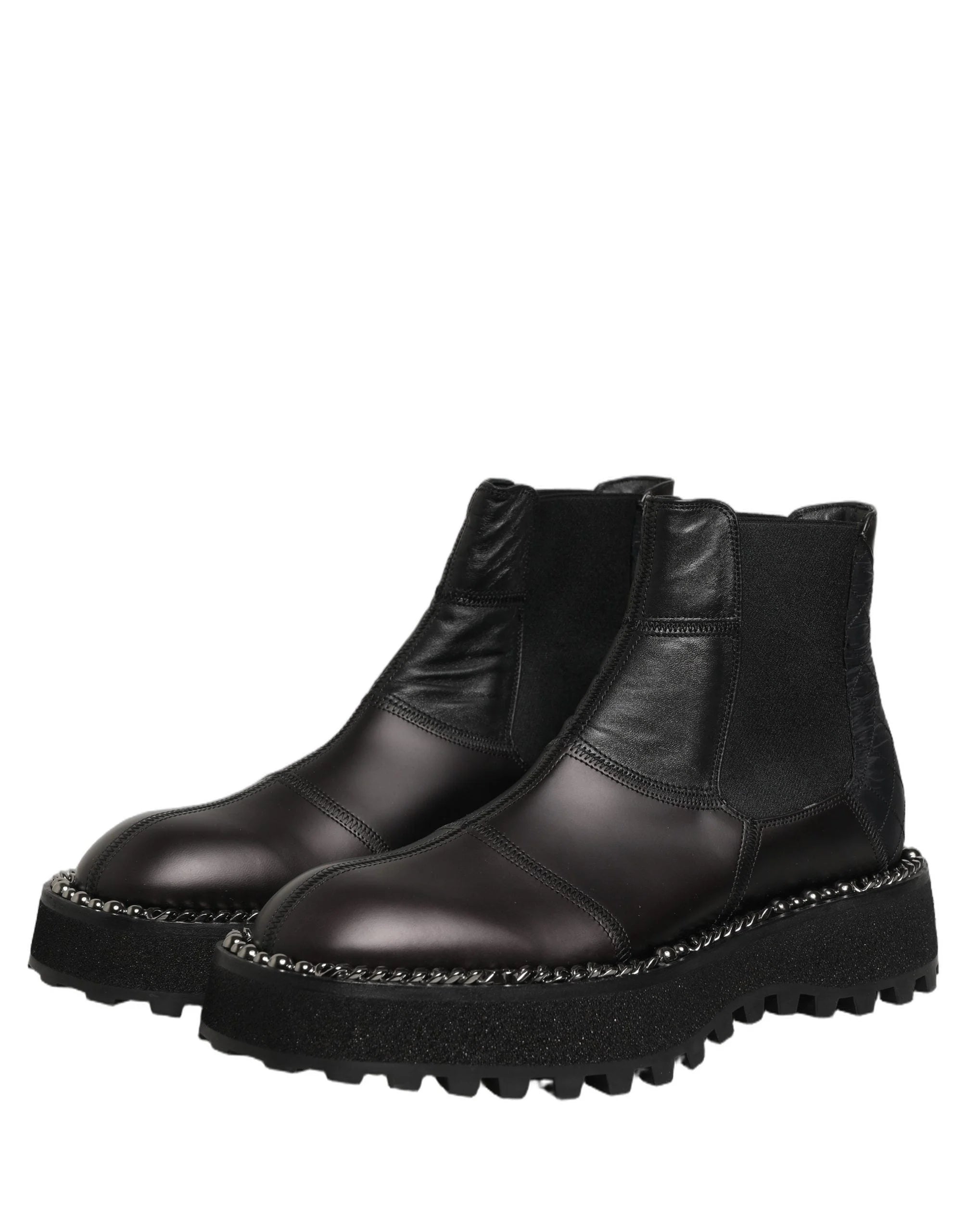 Angled studio shot of the Dolce & Gabbana black leather Chelsea boots emphasizing the polished exterior.