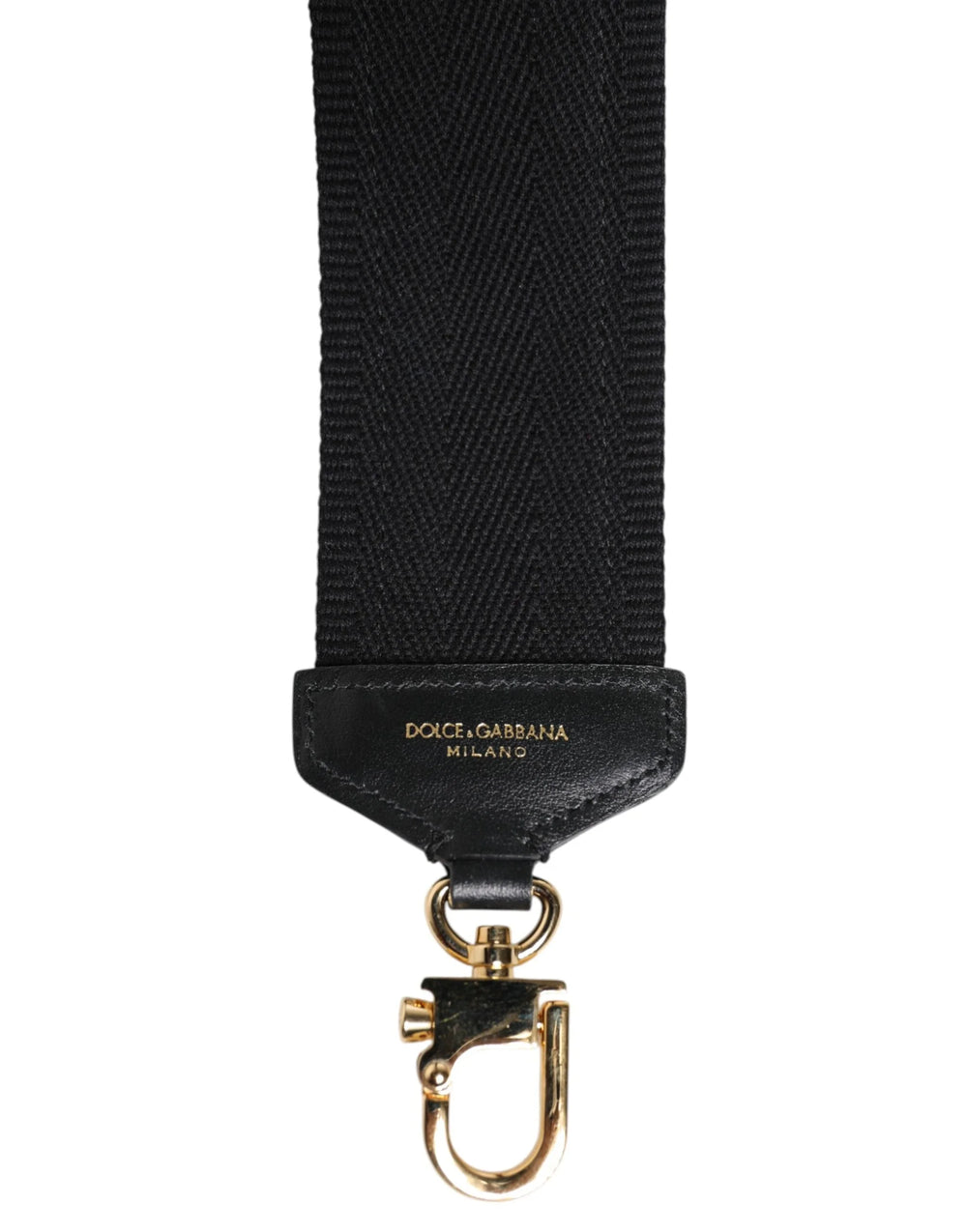 Priveliște detaliată a imprimeului alb grafic pe țesătura de bumbac negru a acestui autentic accesoriu Dolce & Gabbana pentru geantă.