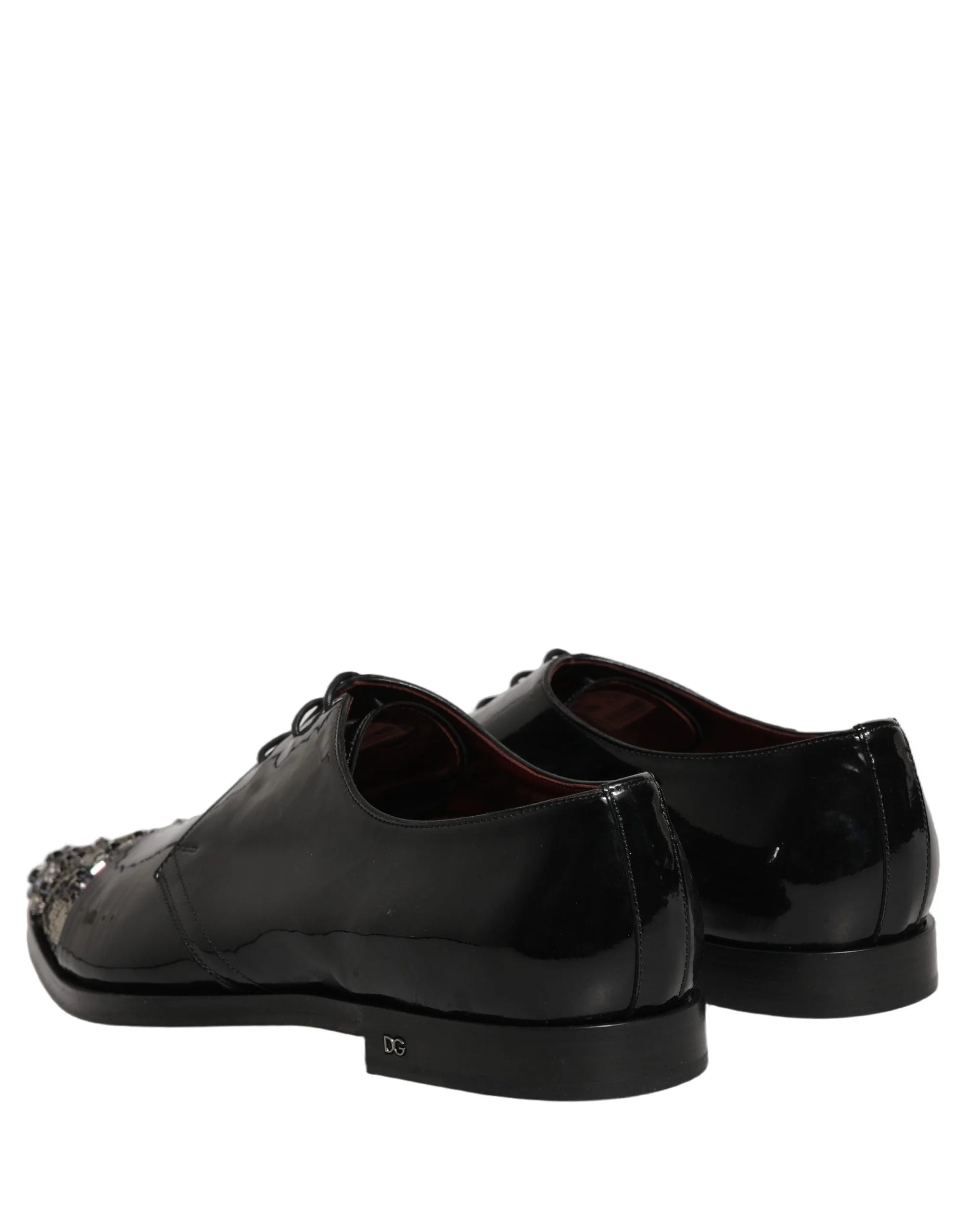 Close-up of the premium black leather texture and precision stitching on these Dolce & Gabbana formal evening shoes.