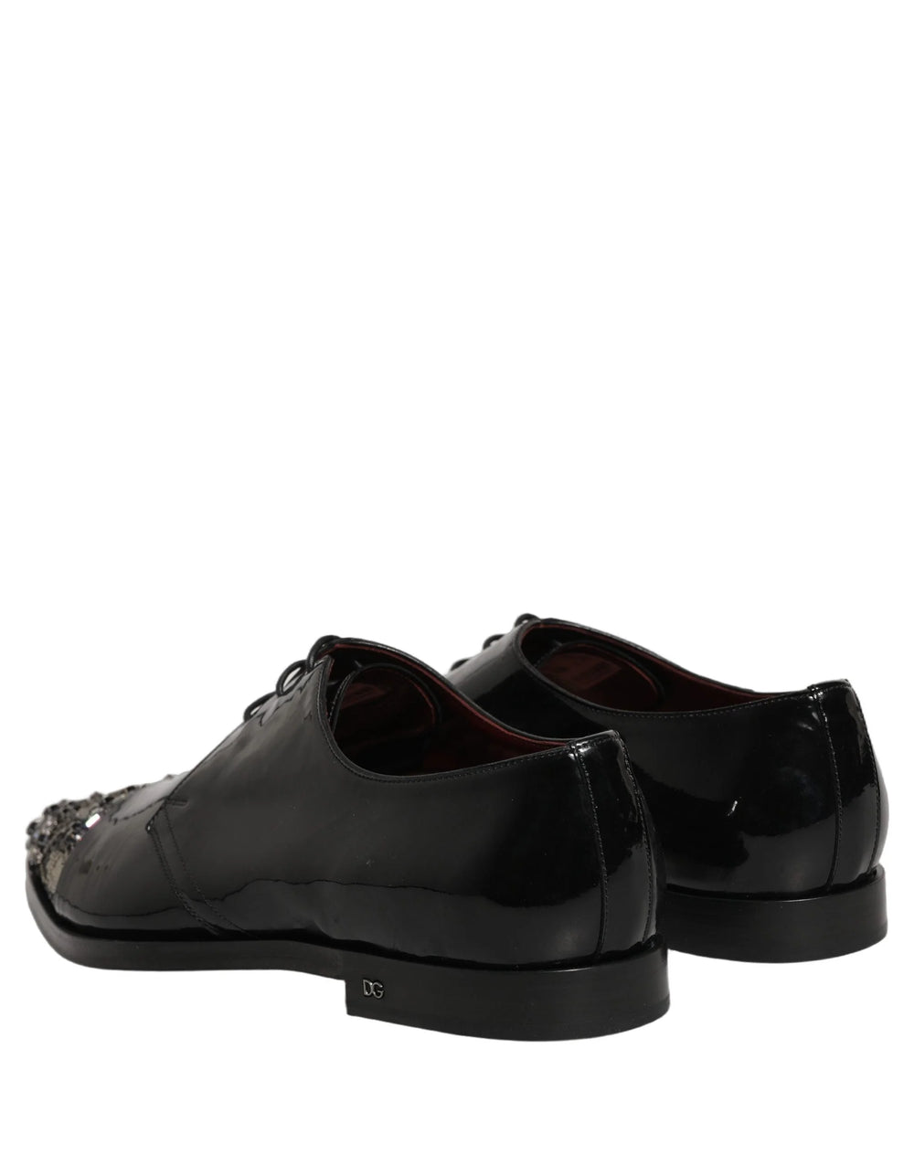 Close-up of the premium black leather texture and precision stitching on these Dolce & Gabbana formal evening shoes.