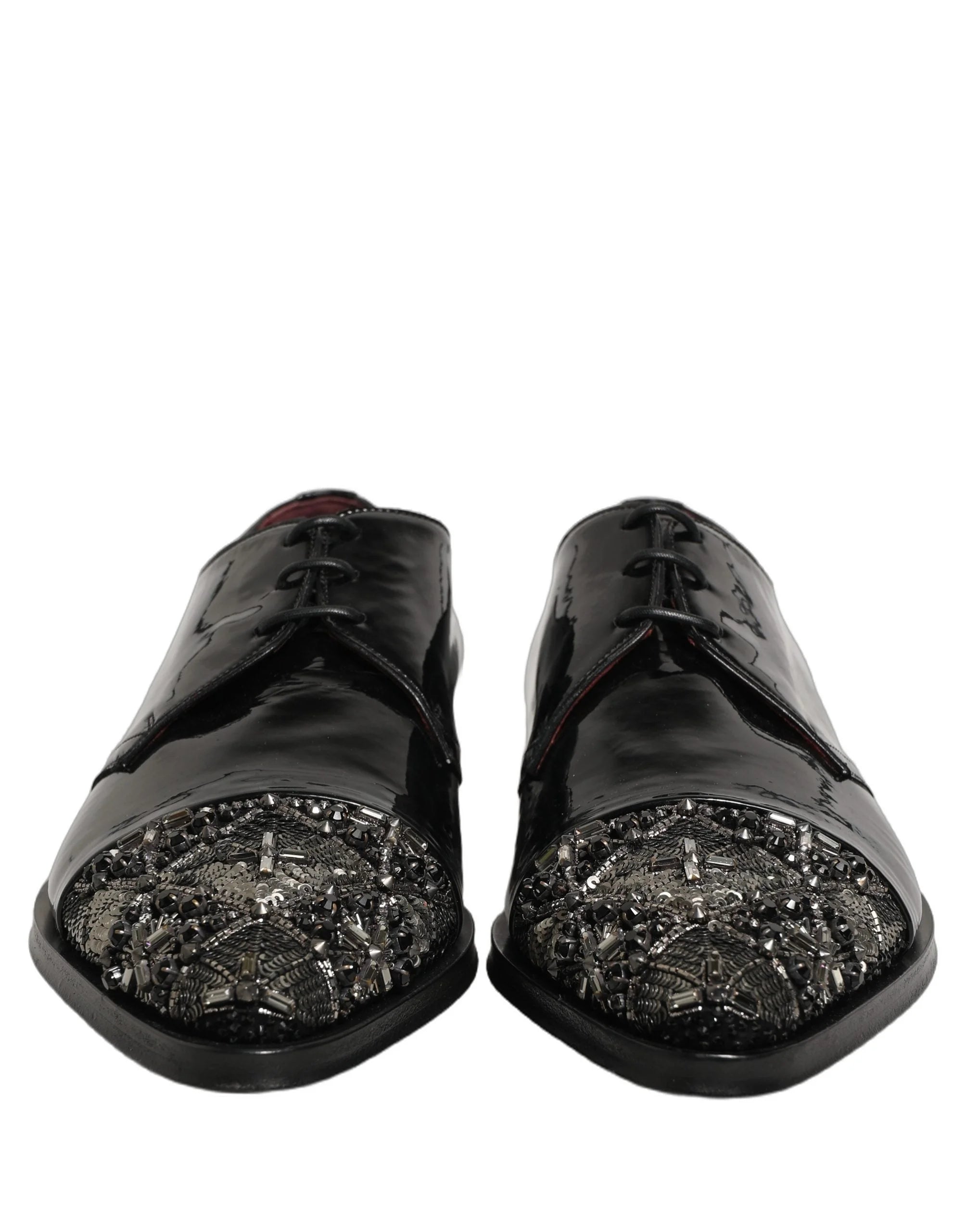 Side profile of Dolce & Gabbana men's black formal Derbies showcasing the elegant curve and crystal-encrusted heel.