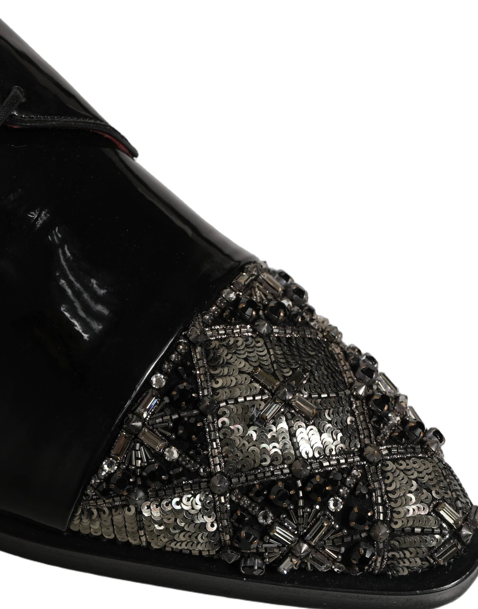 Dolce & Gabbana black leather embellished Derby shoes featuring intricate crystal detailing on a formal silhouette.