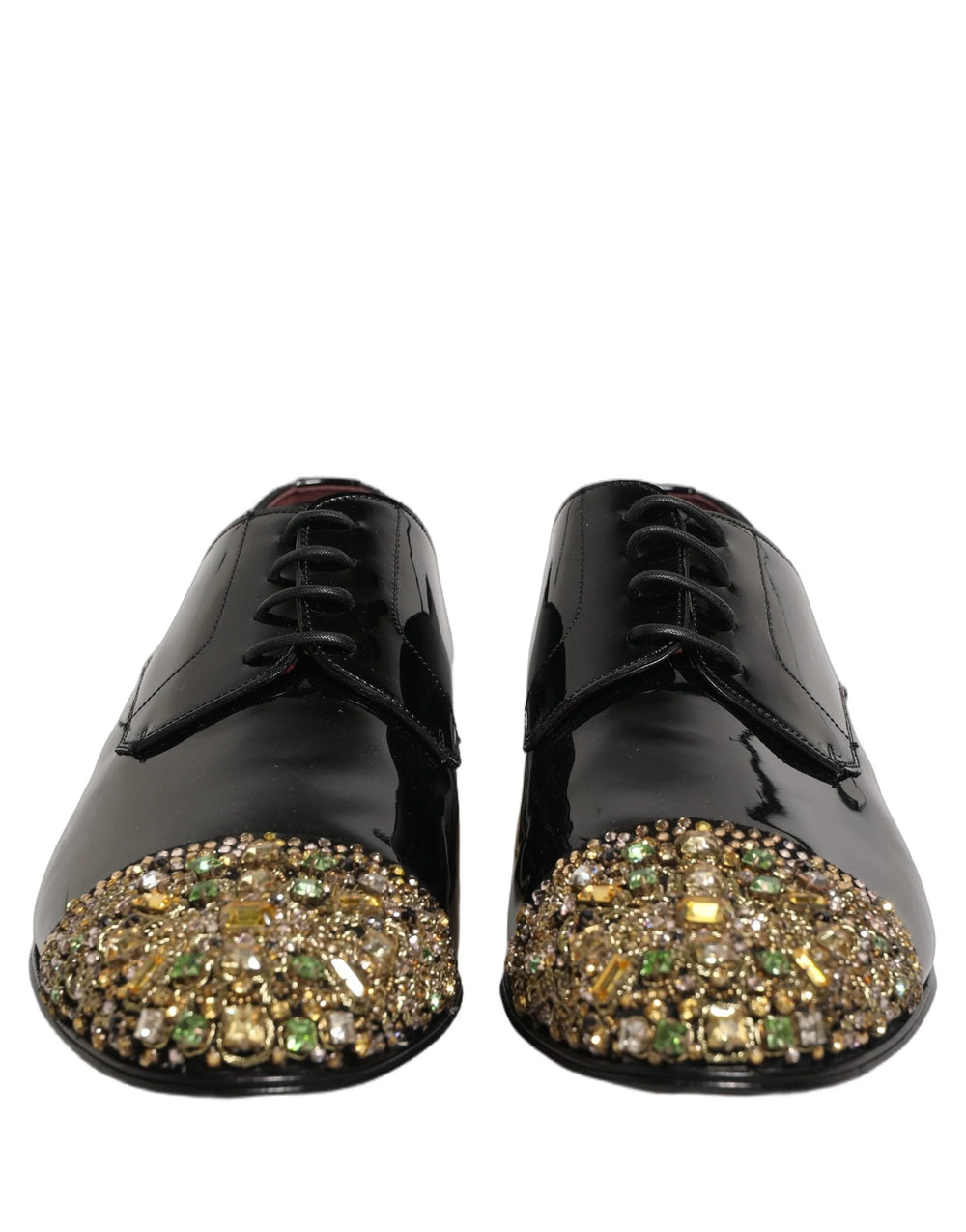 Sideprofil av Dolce & Gabbana pyntede svarte lær-Derbies som viser den slanke formelle silhuetten.