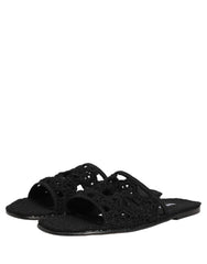 Top-down view of black Dolce & Gabbana slides showcasing the intricate woven pattern and comfortable footbed.