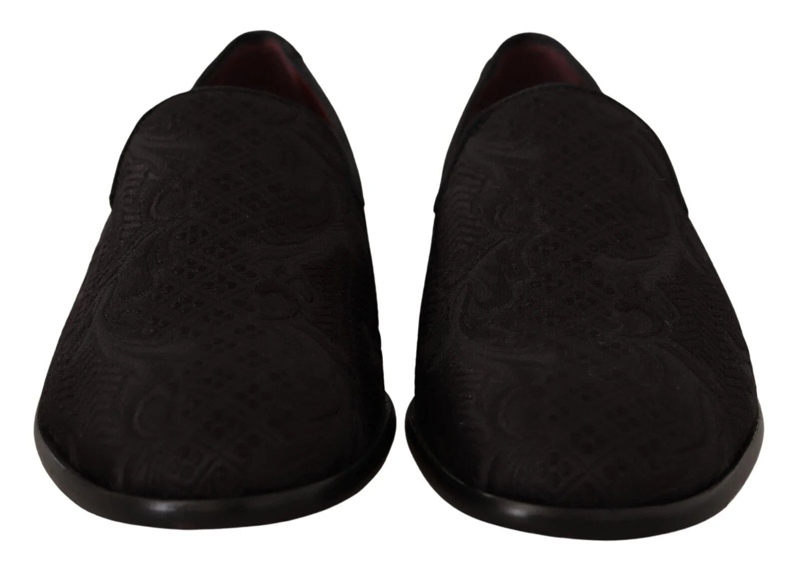 Side profile of Dolce & Gabbana black brocade loafers showing the elegant silhouette and low stacked heel.