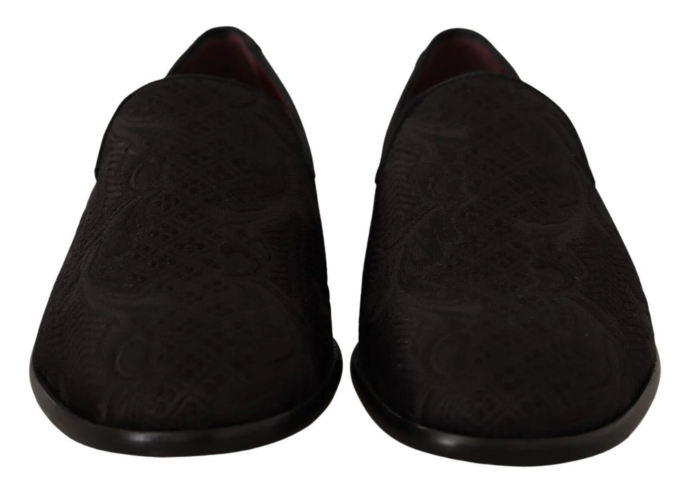 Side profile of Dolce & Gabbana black brocade loafers showing the elegant silhouette and low stacked heel.