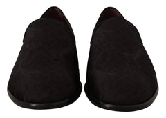 Side profile of Dolce & Gabbana black brocade loafers showing the elegant silhouette and low stacked heel.