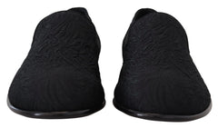 Rear view of the Dolce & Gabbana floral slippers highlighting the structured heel and premium black cotton-silk fabric.