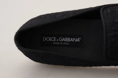 Side profile of Dolce & Gabbana black jacquard loafers showing the sleek evening shoe design and low stacked heel.