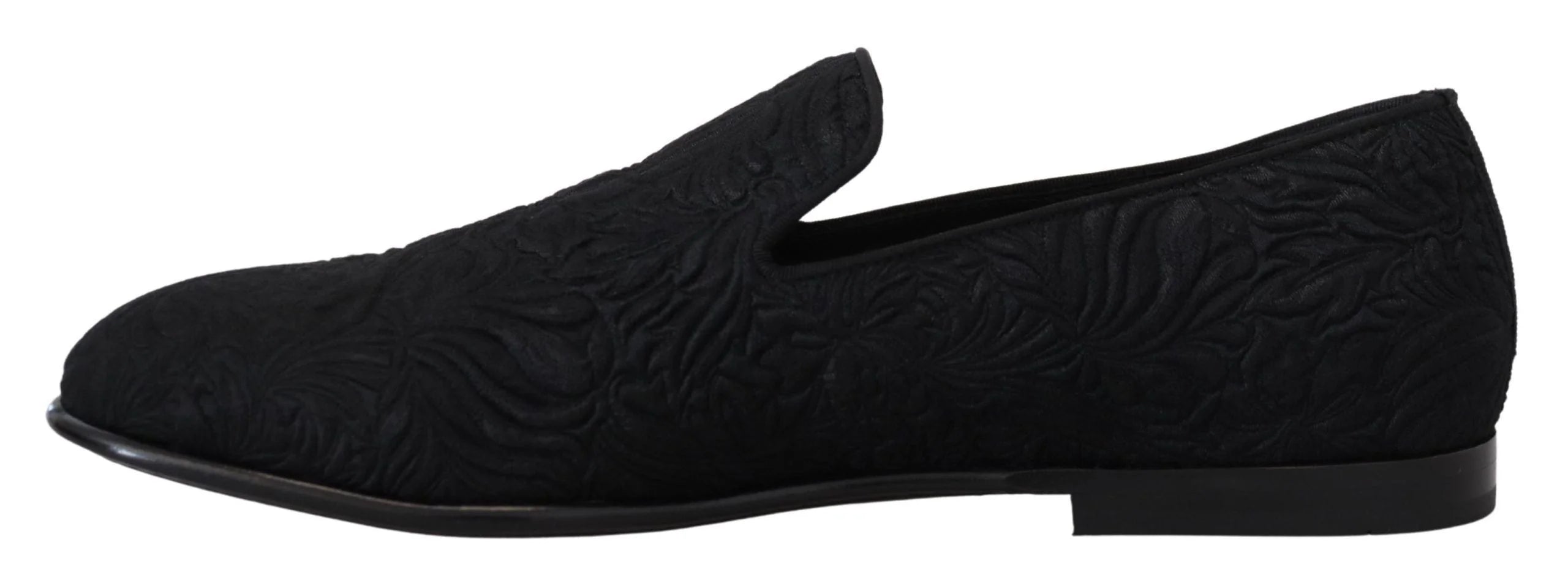 Detailed view of the Dolce & Gabbana branded leather insole and quilted lining of the black formal evening loafers.