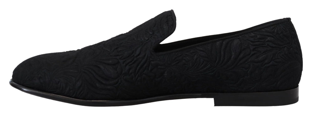 Detailed view of the Dolce & Gabbana branded leather insole and quilted lining of the black formal evening loafers.