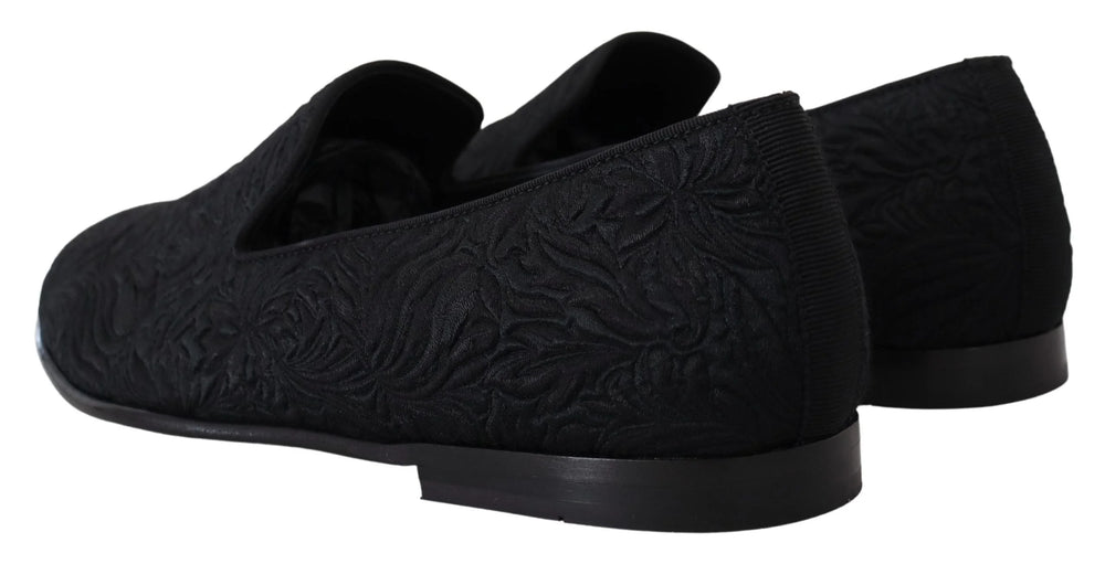 Close-up of the luxurious floral jacquard weave on Dolce & Gabbana slippers, illustrating the fine textile craftsmanship.