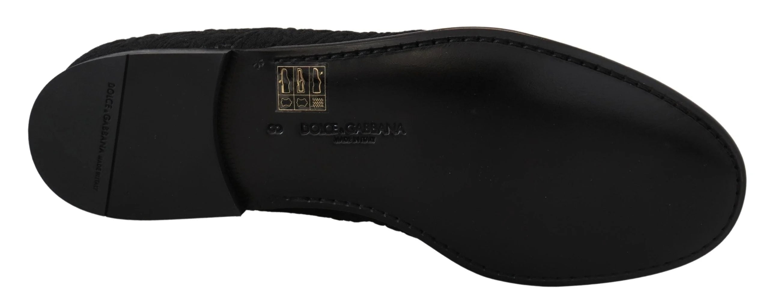 Angled view of the Dolce & Gabbana black floral loafers, a testament to the brand's heritage in evening footwear.
