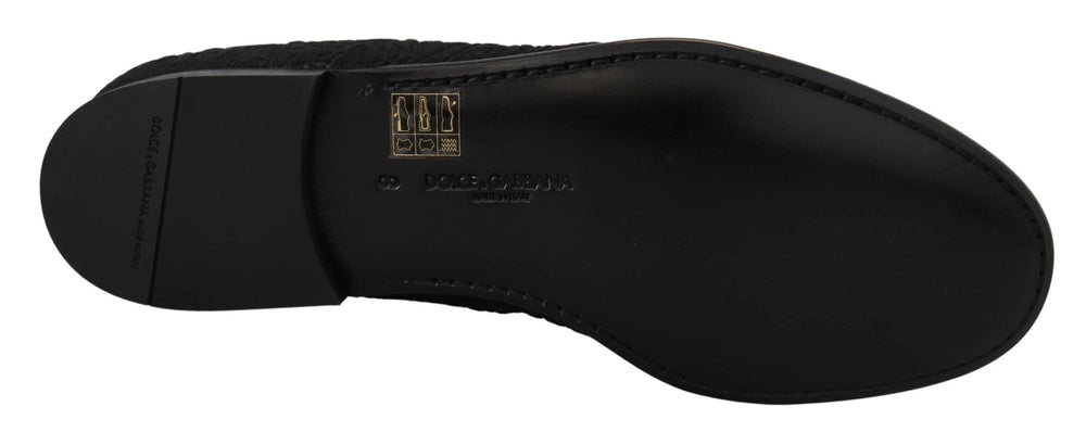 Angled view of the Dolce & Gabbana black floral loafers, a testament to the brand's heritage in evening footwear.