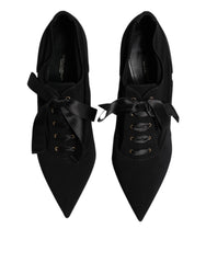 Side profile of Dolce & Gabbana black stilettos showing the sleek 10 cm heel and refined viscose-blend texture.
