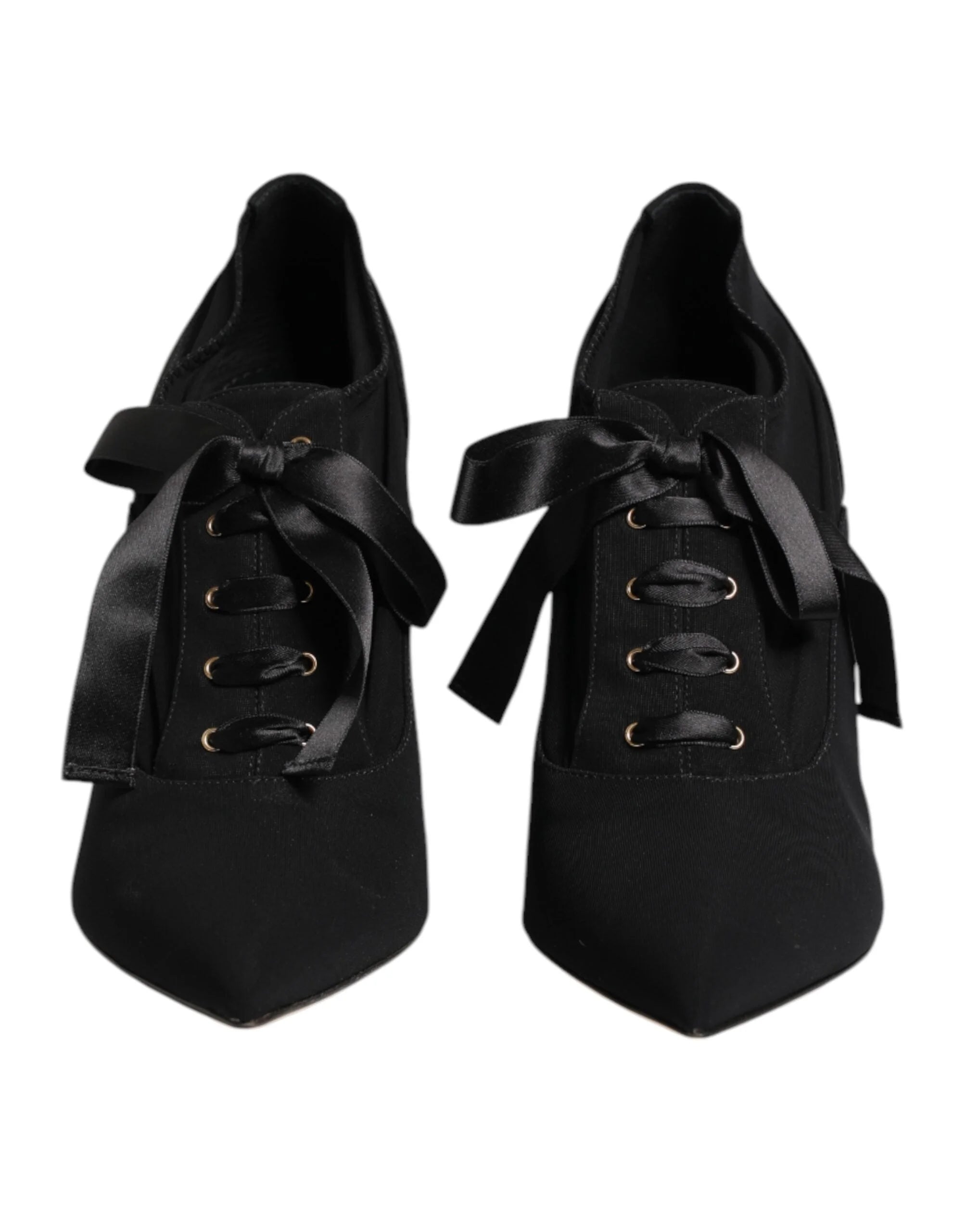 Dolce & Gabbana black lace-up stiletto pumps featuring a pointed toe and elegant wrap-around ankle ties.