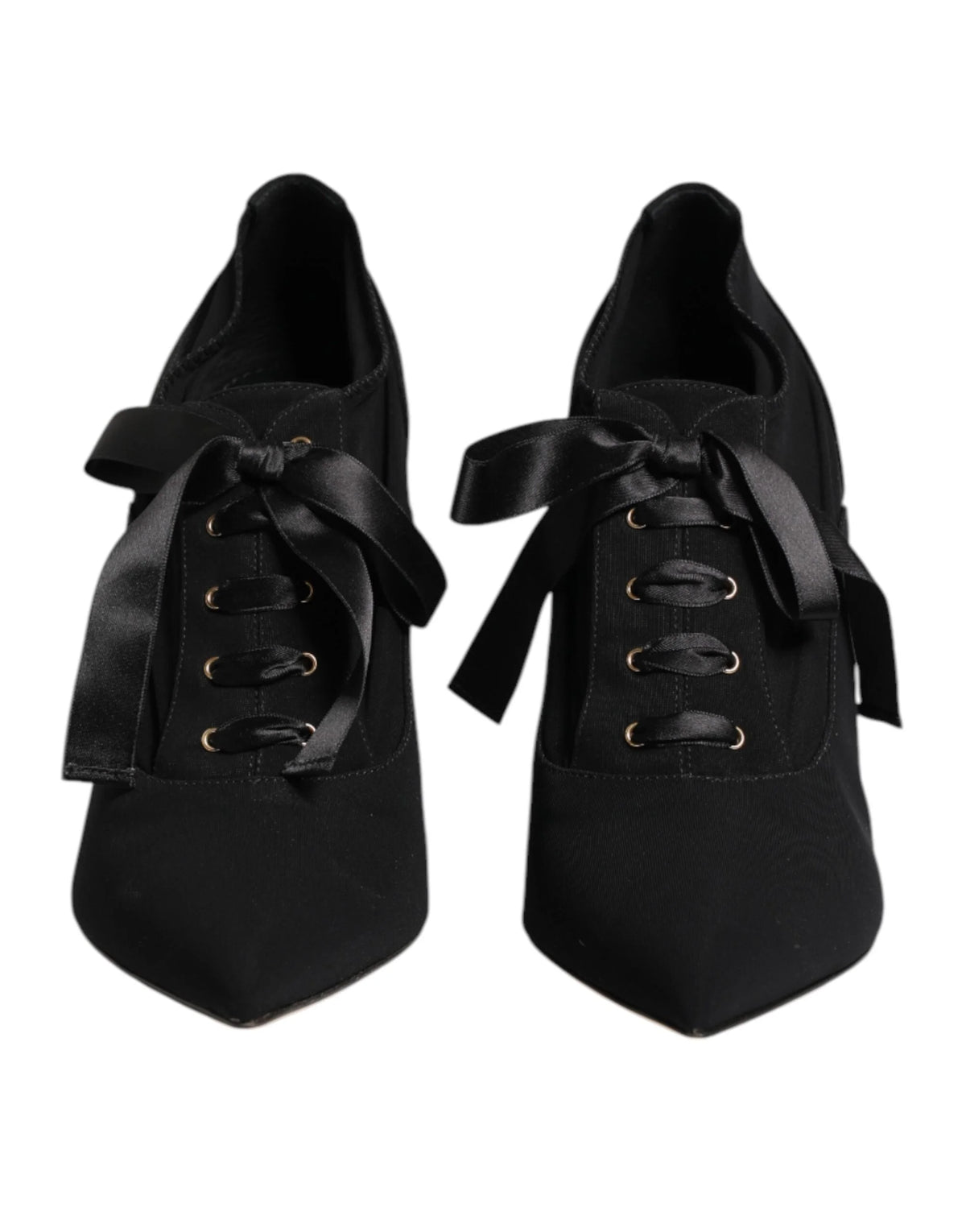 Dolce & Gabbana black lace-up stiletto pumps featuring a pointed toe and elegant wrap-around ankle ties.