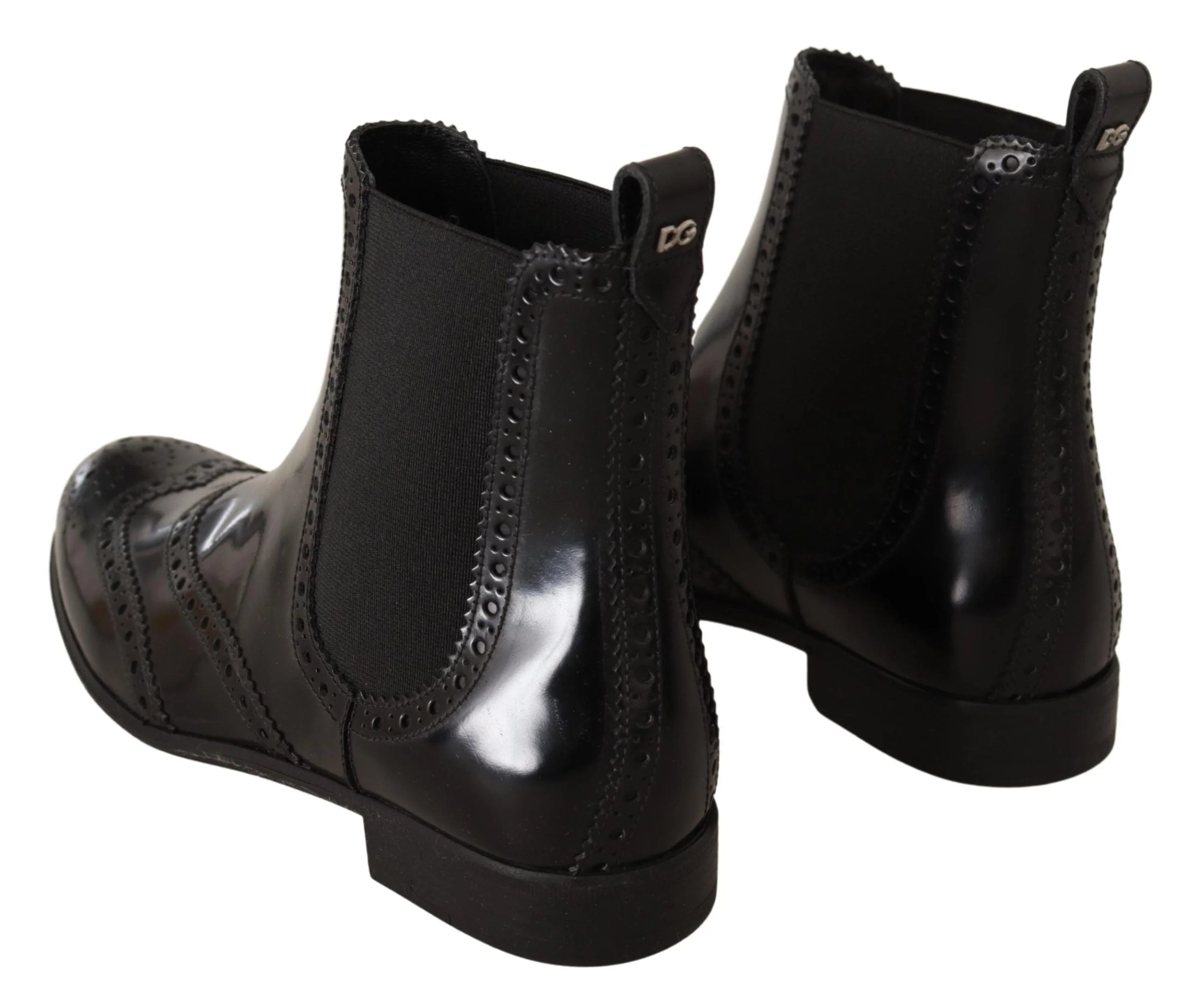 Side profile of Dolce & Gabbana women's flat leather boots in black, showcasing the refined craftsmanship and low heel.