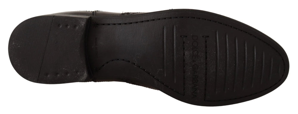 Close-up of the premium black leather texture and tonal stitching on these luxury Dolce & Gabbana ankle boots.