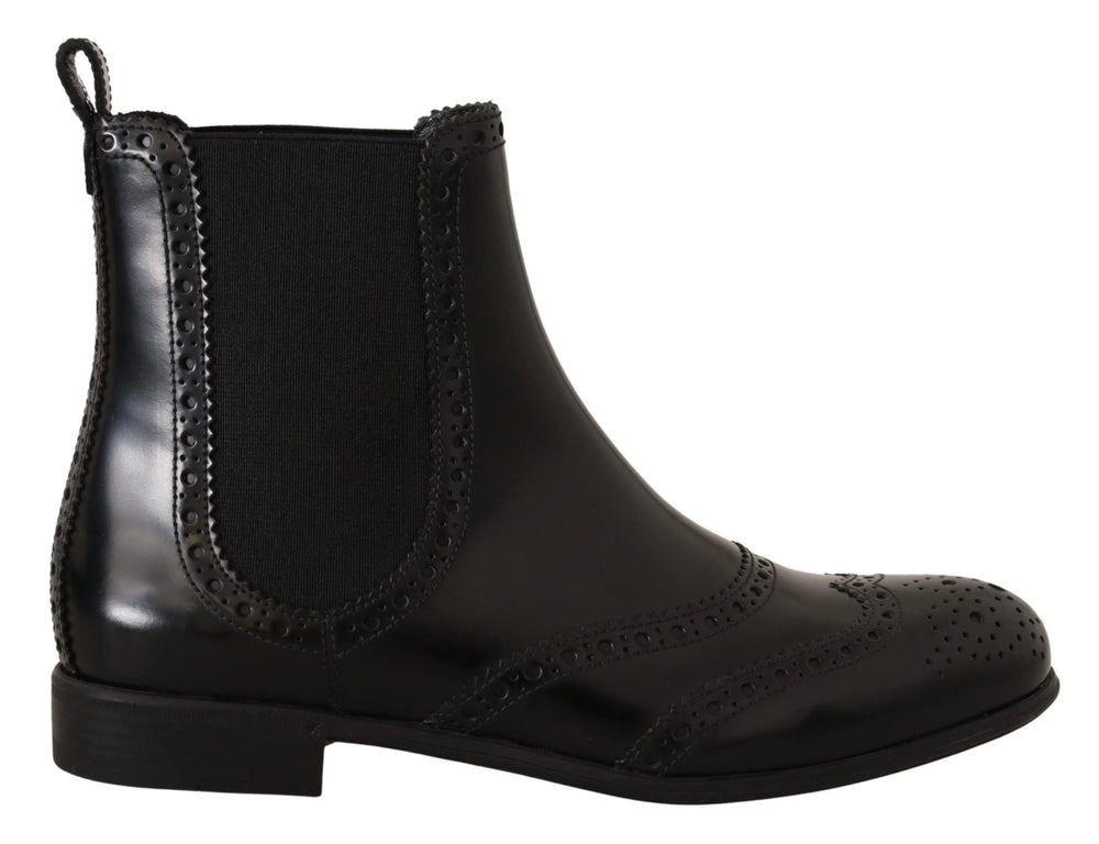 Top-down view of the Dolce & Gabbana black leather Chelsea boots, emphasizing the elegant almond toe shape.