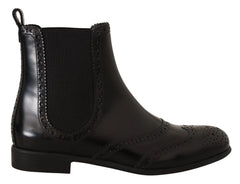 Top-down view of the Dolce & Gabbana black leather Chelsea boots, emphasizing the elegant almond toe shape.
