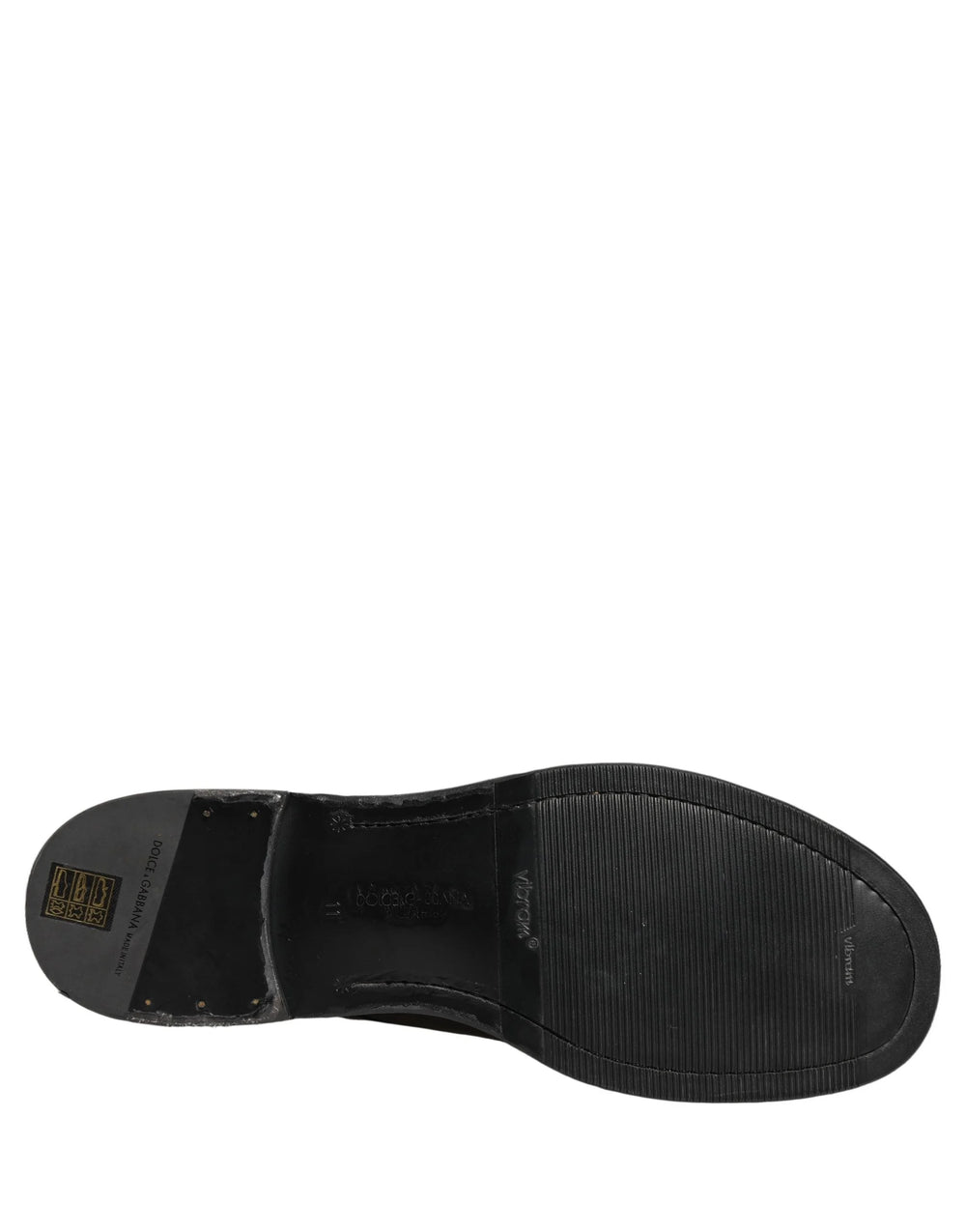 Van bovenaf van Dolce & Gabbana zwarte leren veterschoenen, met een elegante amandelteen en interieur branding.