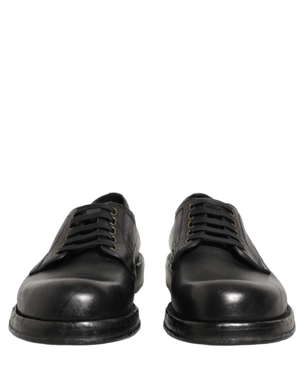 Gedetailleerd beeld van de duurzame lederen zool en hielconstructie op Dolce & Gabbana luxe dress schoenen.