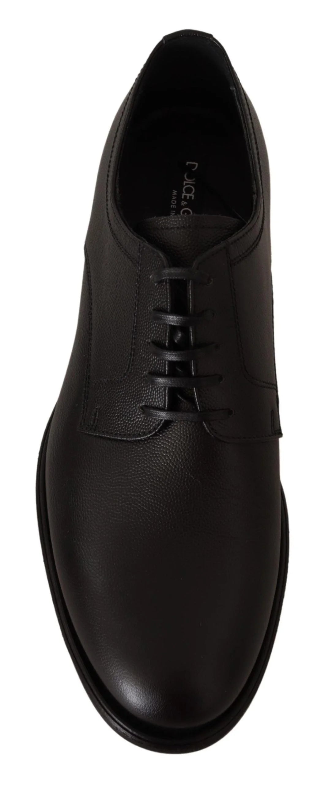 Detalhe do forro interior de couro e da palmilha com marca dos sapatos Derby pretos Dolce & Gabbana com cadarços.