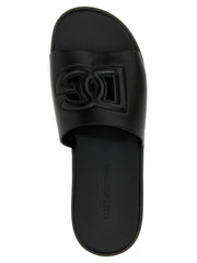 Close-up of the premium leather texture and precise stitching on these Italian-made Dolce & Gabbana luxury slides.