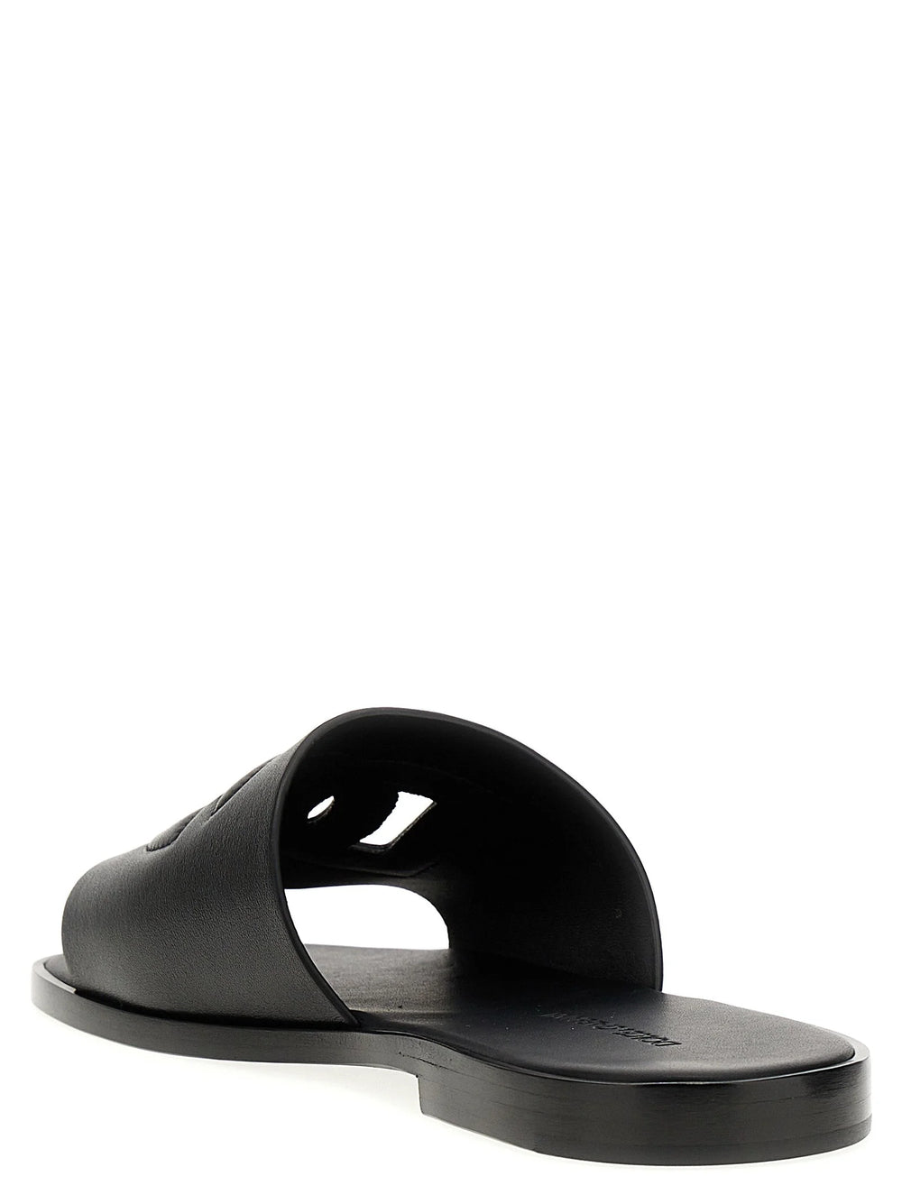 Side profile of black leather Dolce & Gabbana flat sandals showing the contoured footbed and durable rubber sole.
