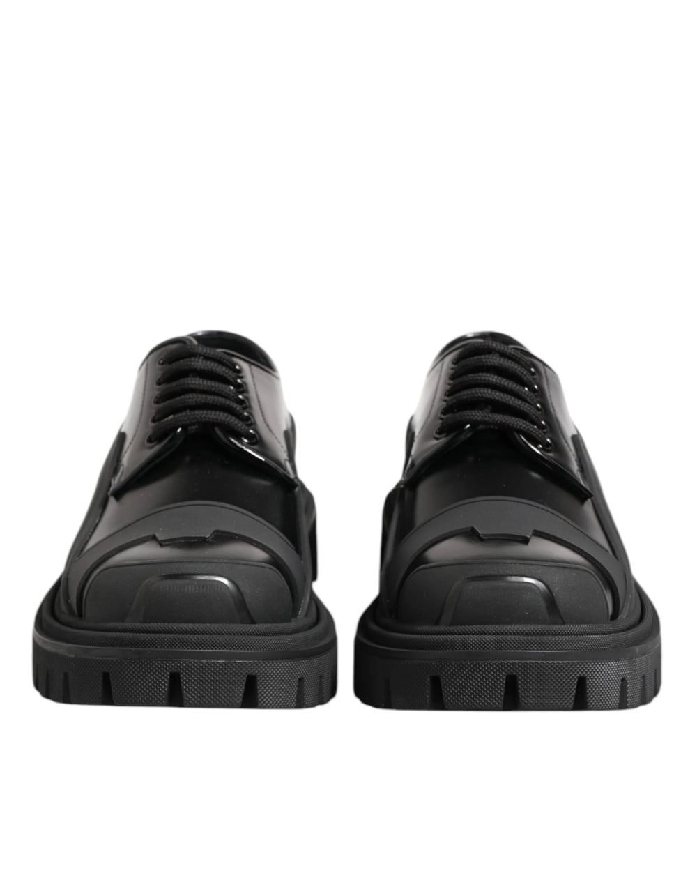 Derbies de randonnée en cuir patenté noir calfskin Dolce & Gabbana avec une finition brillante et une semelle épaisse à crampons.