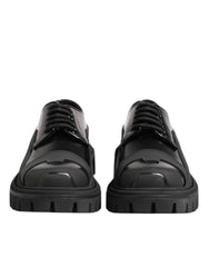 Derbies de randonnée en cuir patenté noir calfskin Dolce & Gabbana avec une finition brillante et une semelle épaisse à crampons.