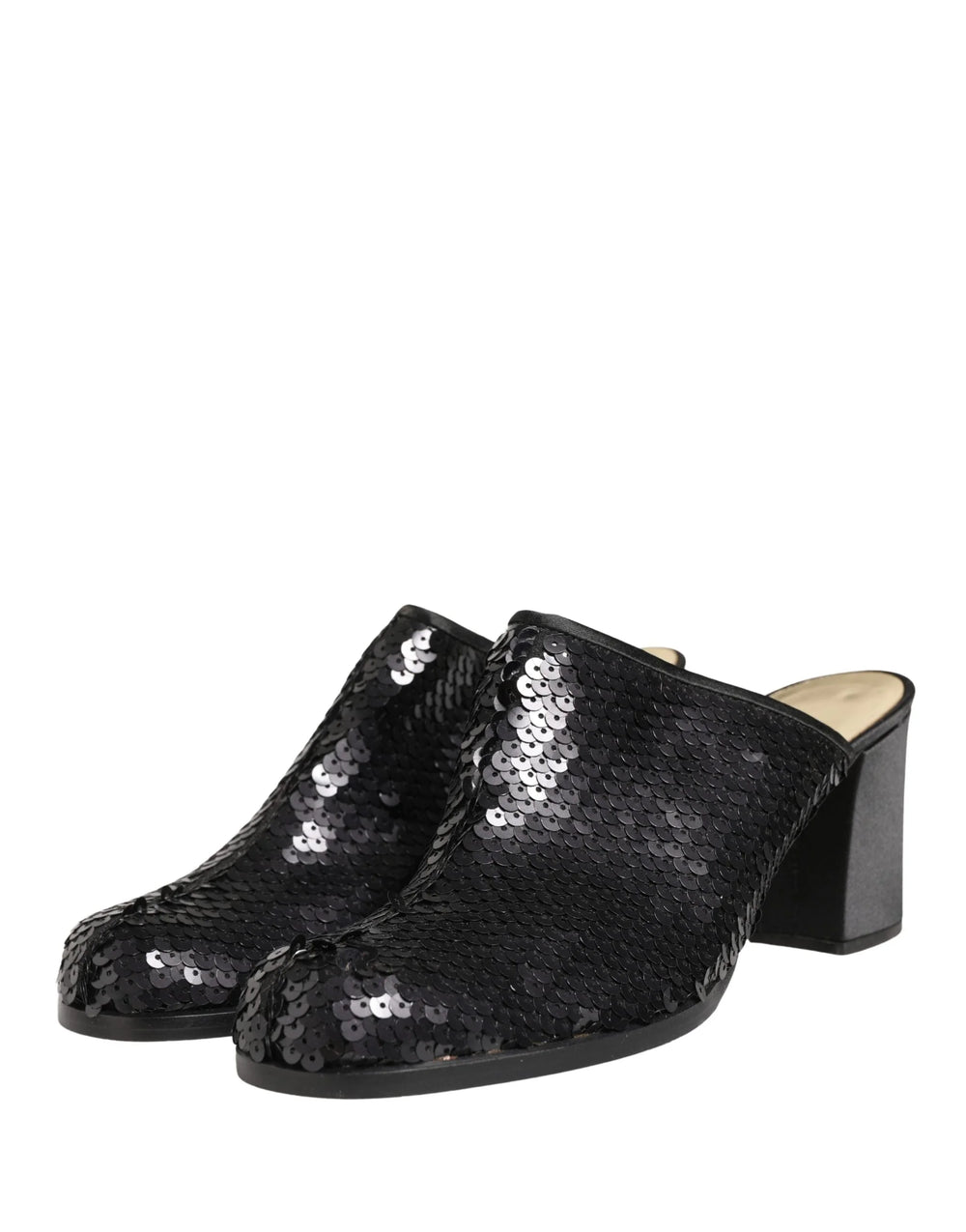Side profile of Dolce & Gabbana sequined pumps featuring a sleek silhouette and refined leather sole construction.