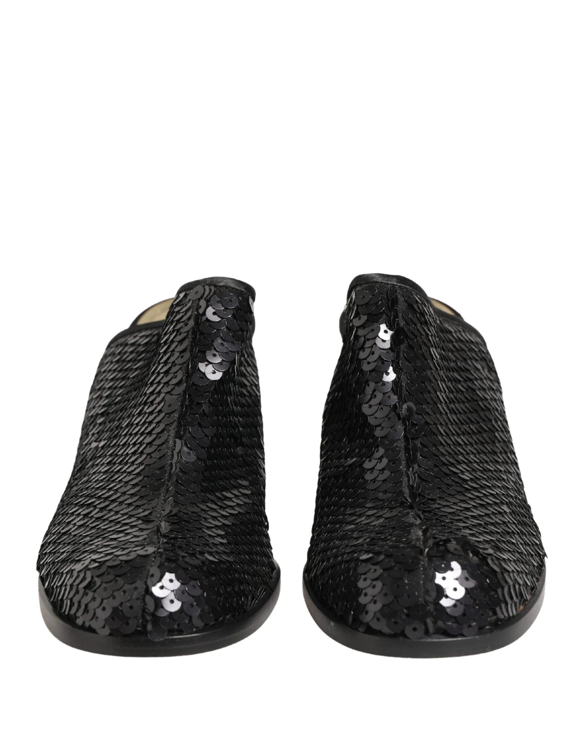 Dolce & Gabbana black sequined mules with pointed toe and elegant mid-heel, front view showcasing shimmering texture.