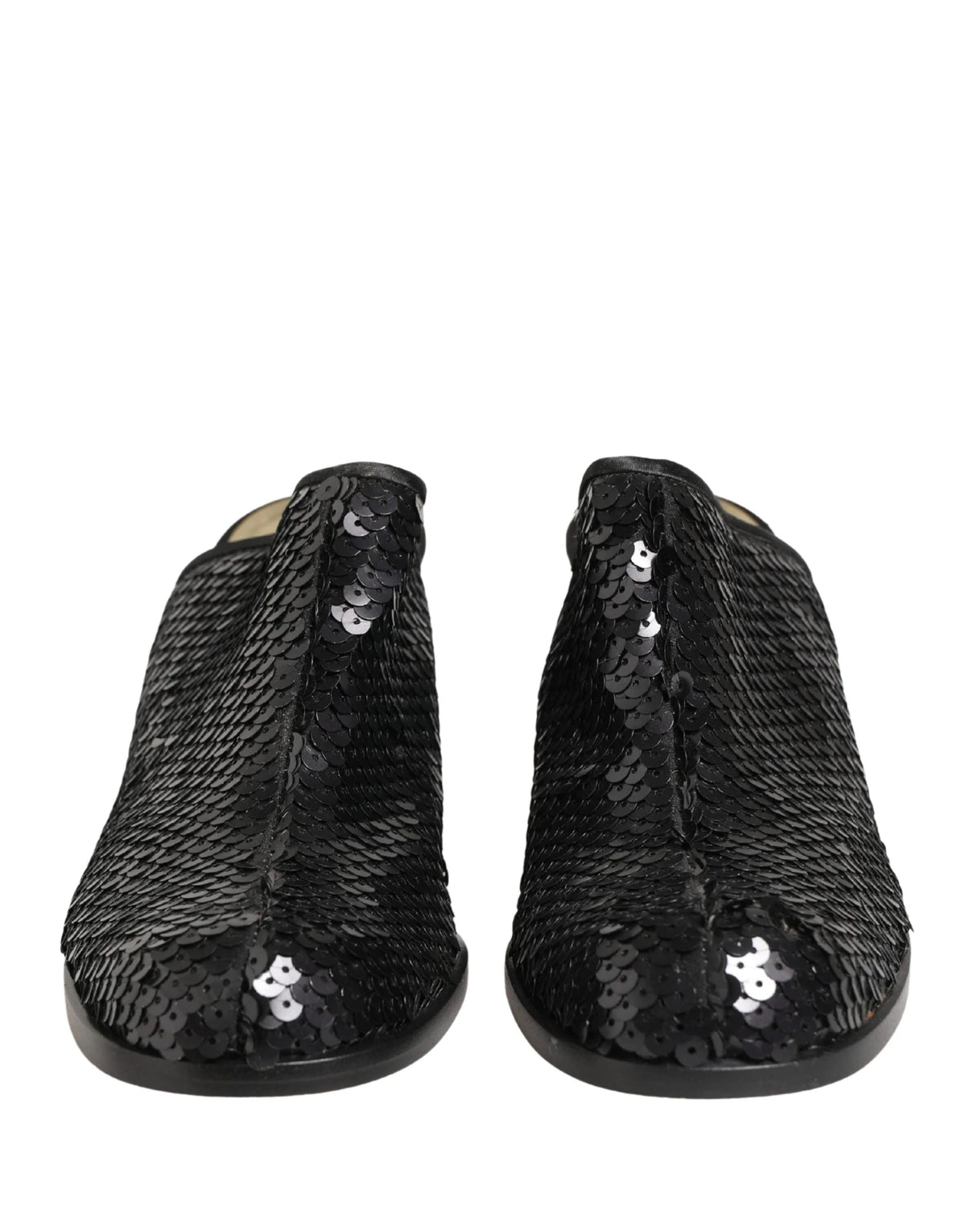 Dolce & Gabbana black sequined mules with pointed toe and elegant mid-heel, front view showcasing shimmering texture.