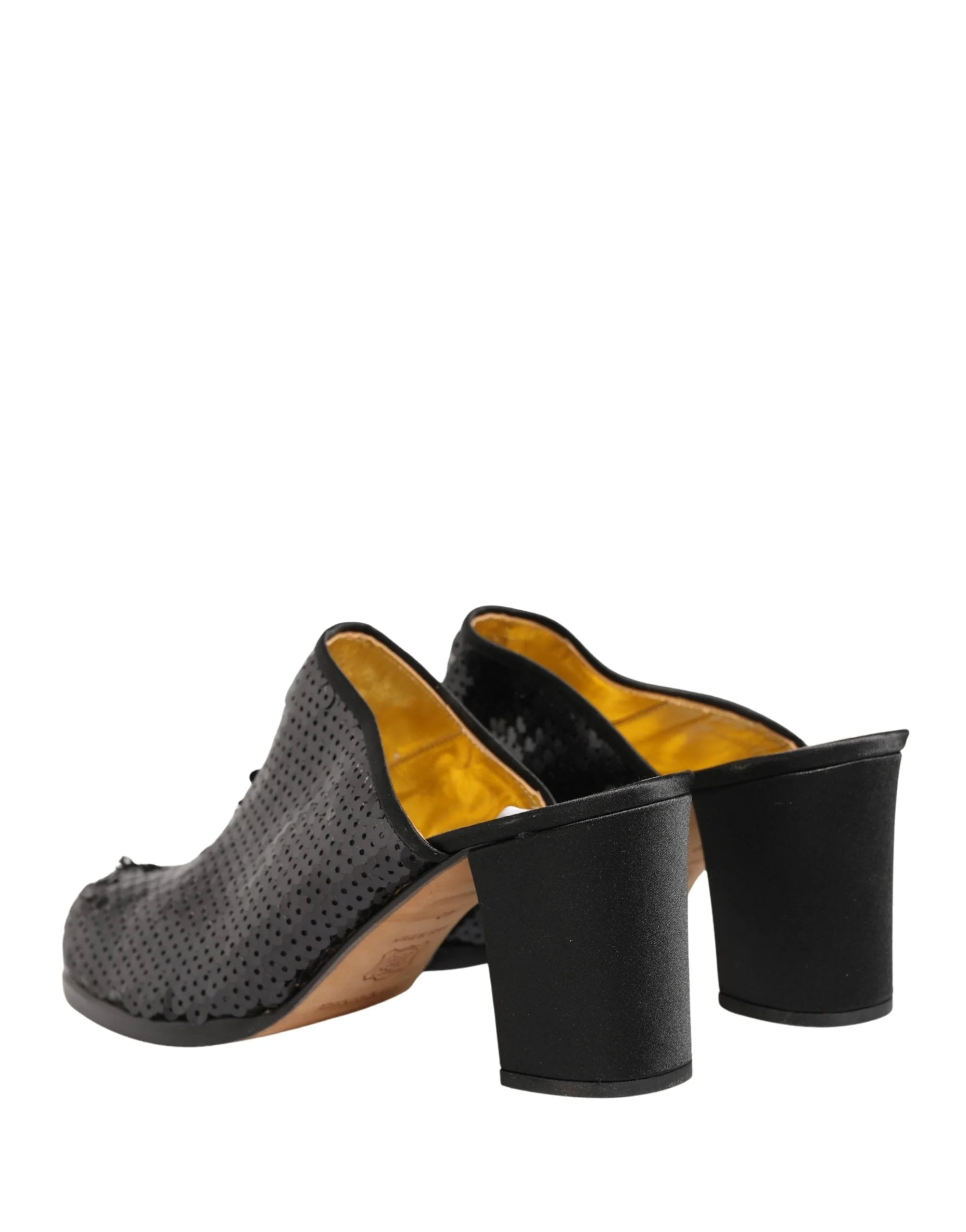 Rear view of black sequined mid-heel mules by Dolce & Gabbana, highlighting the precise heel placement and craftsmanship.