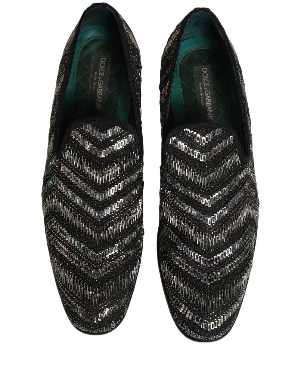 Vista trasera de los mocasines adornados de Dolce & Gabbana que destacan el tacón de cuero estructurado y la artesanía refinada.