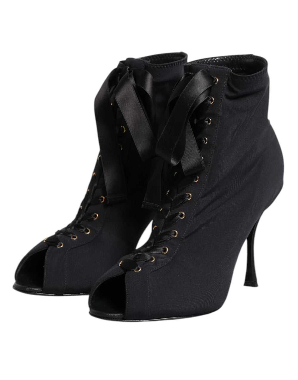 Rear view of black Dolce & Gabbana lace-up boots highlighting the structured heel counter and sleek stiletto silhouette.