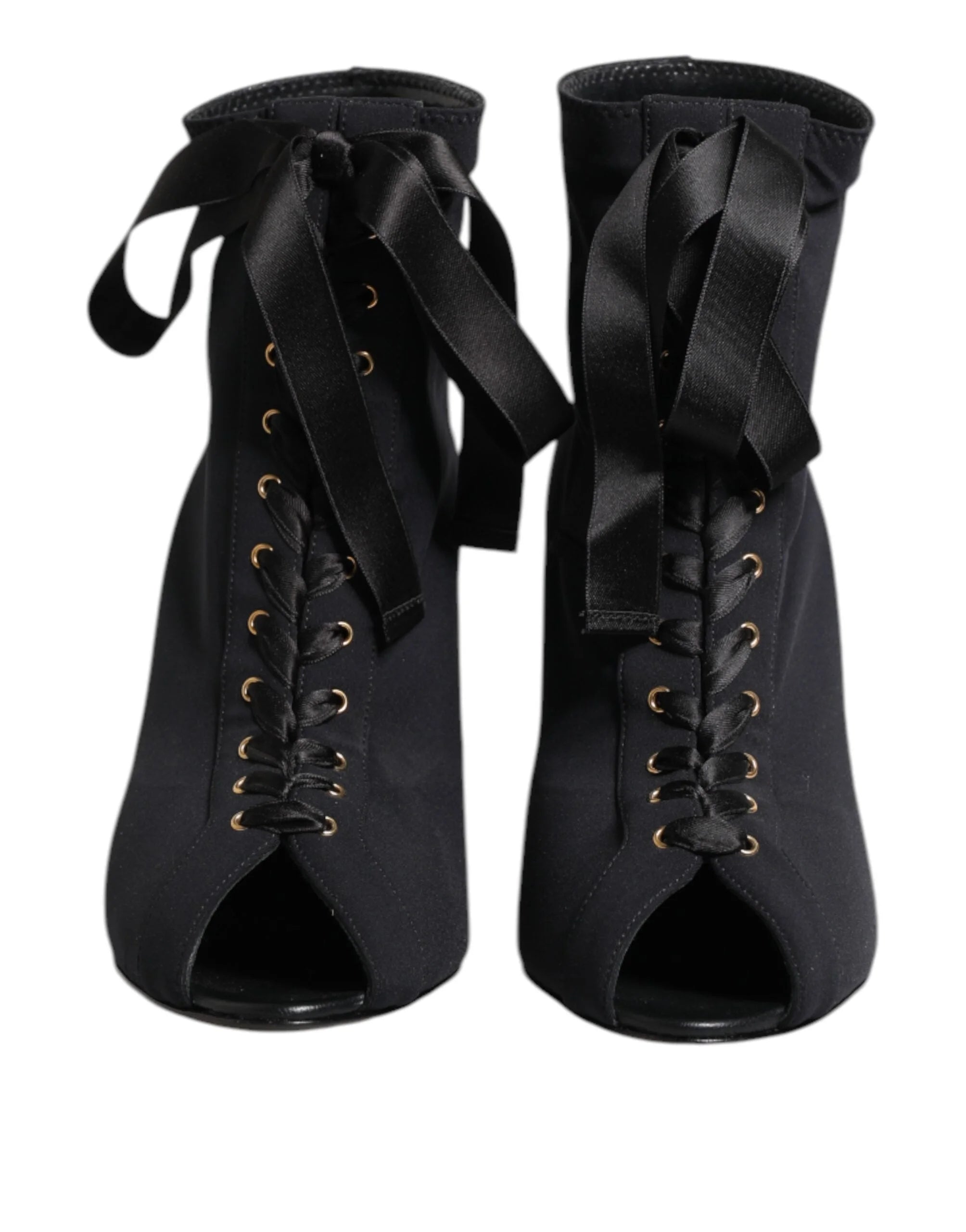 Dolce & Gabbana black leather ankle boots featuring a pointed toe, lace-up front, and elegant stiletto heel.