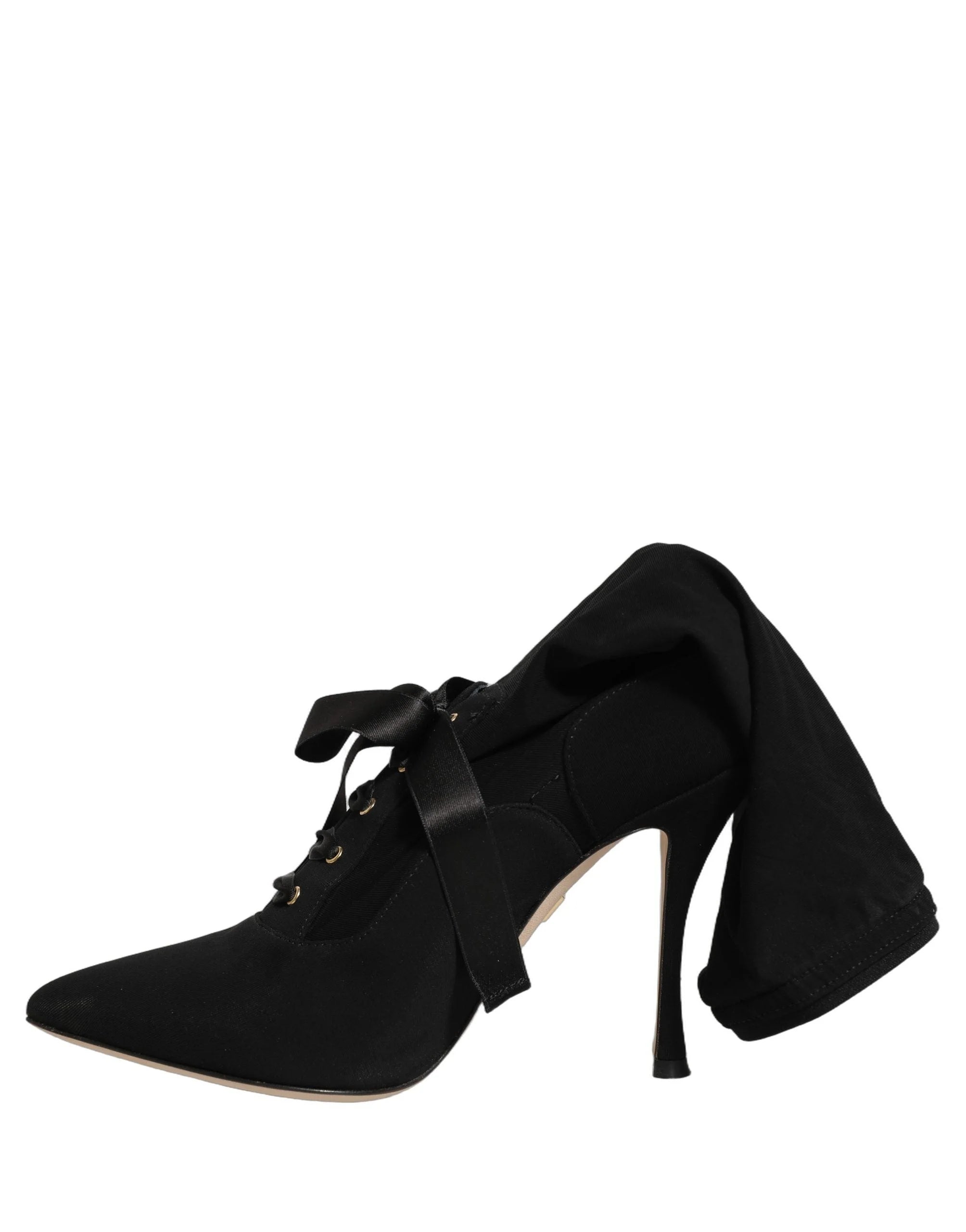 Rückansicht der Dolce & Gabbana Mid-Calf-Stilettettenstiefel, die die präzise Naht und den strukturierten Absatzpfeil hervorheben.