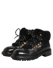 Close-up of the textured black leather and silver-tone hardware on these Italian-crafted Dolce & Gabbana lace-up boots.