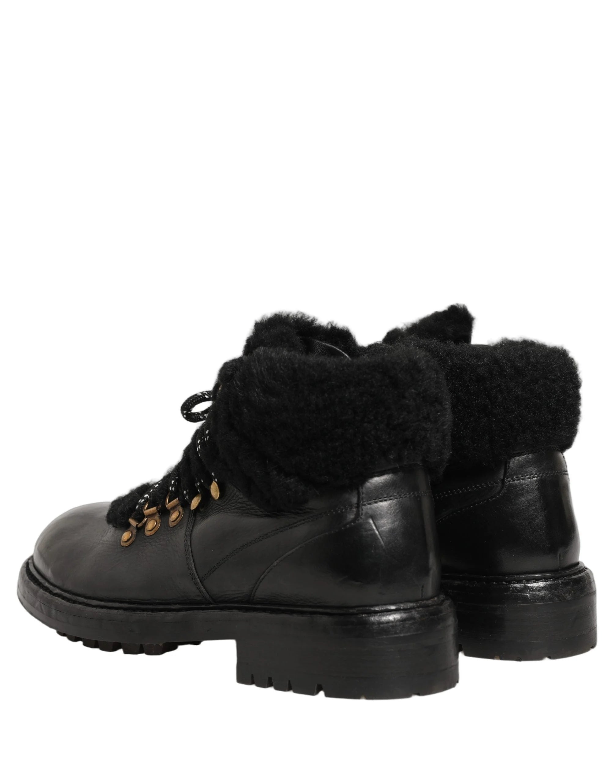 Detailed view of the soft fur interior and branded tongue on the Dolce & Gabbana black leather trekking shoes.