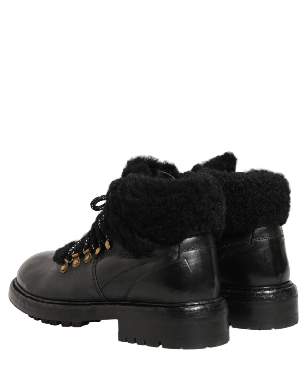 Detailed view of the soft fur interior and branded tongue on the Dolce & Gabbana black leather trekking shoes.