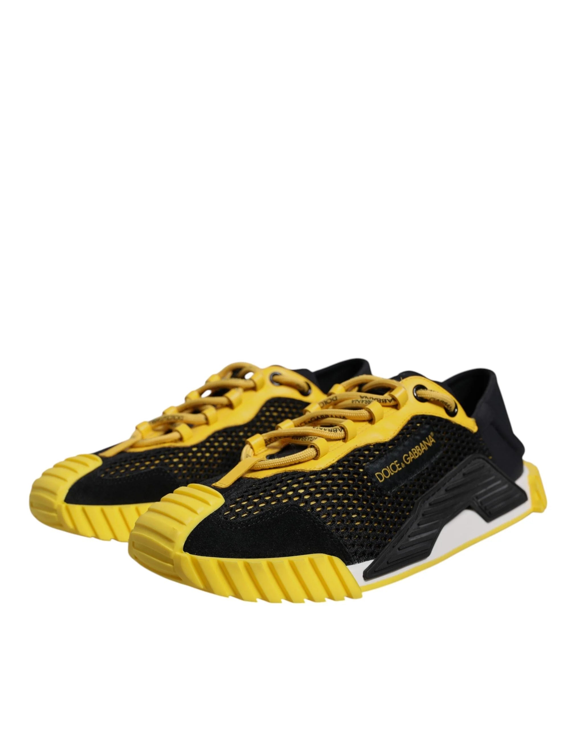 Sidovinkel på Dolce & Gabbana NS1-sneakers med blandade materialpaneler i svart med livfulla gula accenter.