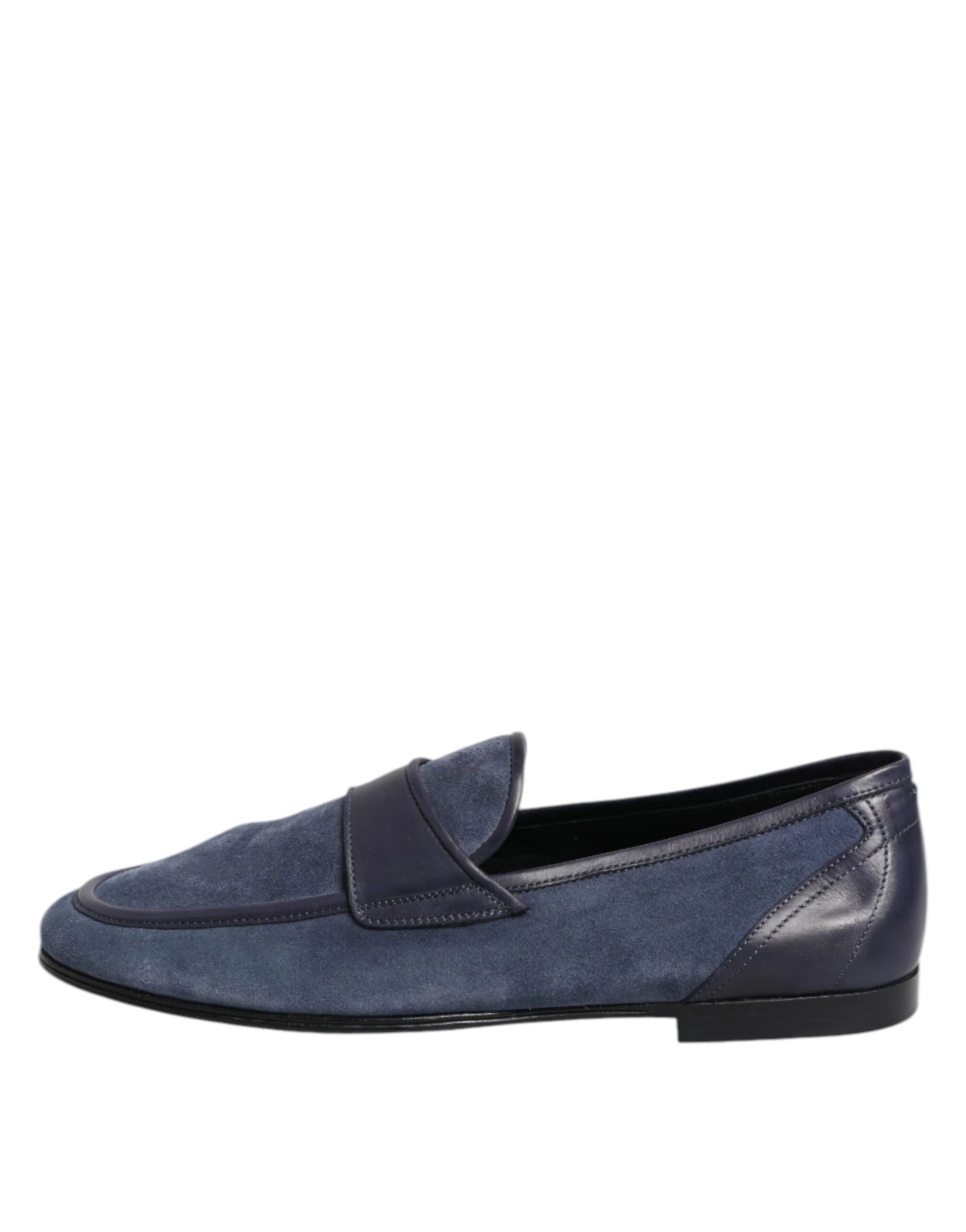 Close-up of the silver-tone Dolce & Gabbana logo plaque on the blue suede upper of these luxury loafers.